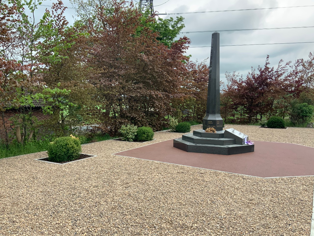 Gravel pathway around memorial 